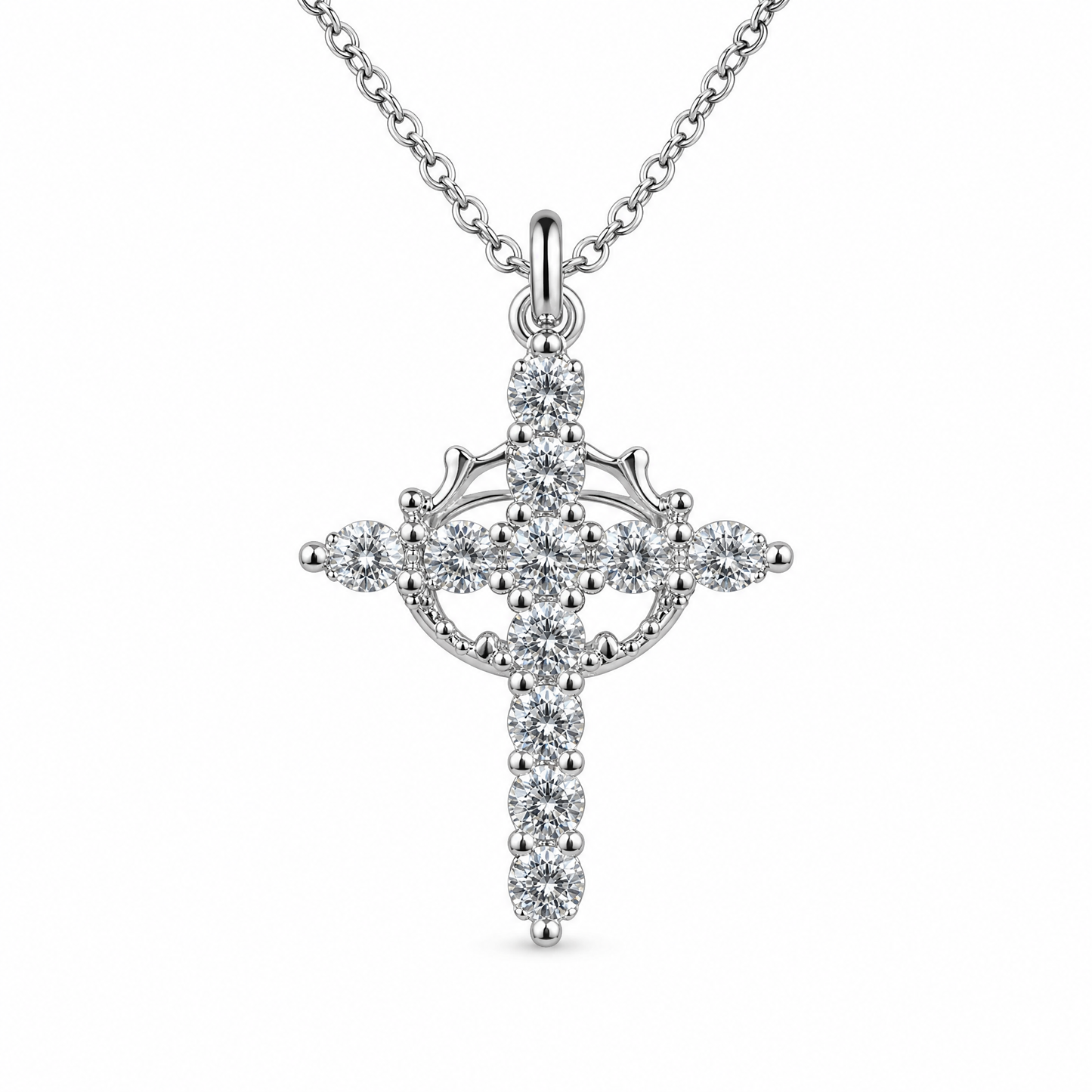 Collar Niña de Mis Ojos en plata: cruz de circonitas con corona giratoria en el centro
