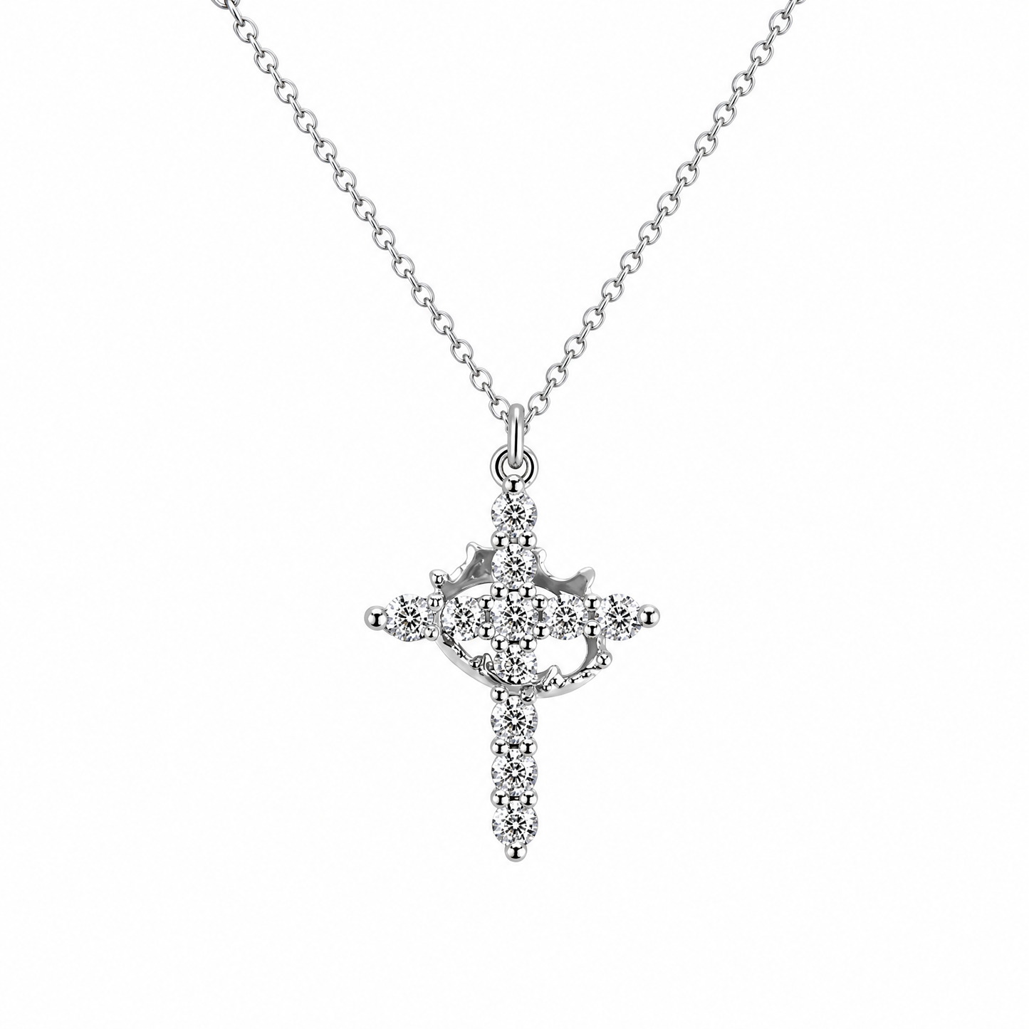 Collar Niña de Mis Ojos en plata: cruz de circonitas con corazón calado en el centro